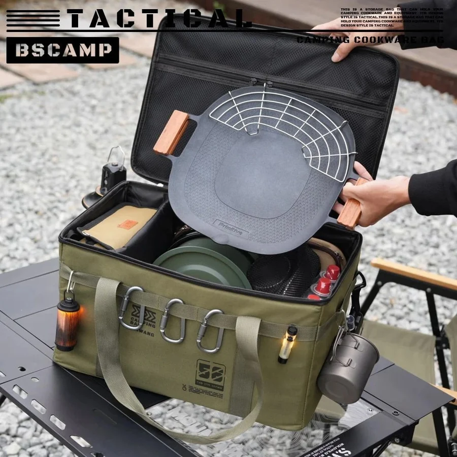 Camp kitchen storage bag open with a griddle and pots